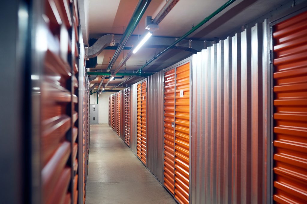 Row of storage containers in warehouse
